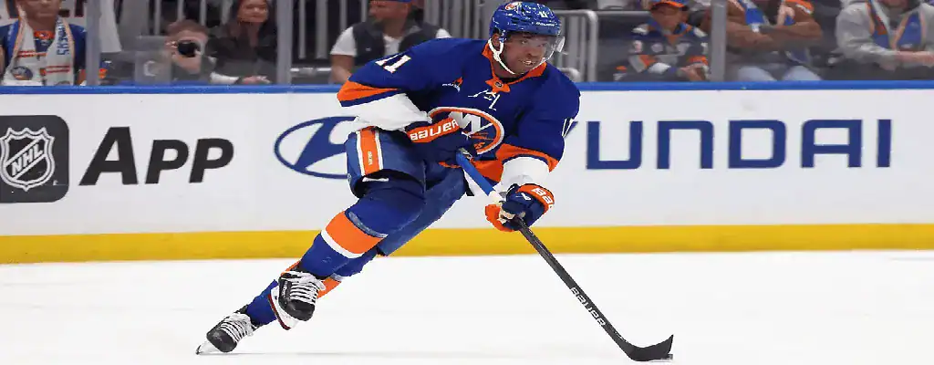 New York Islanders vs Winnipeg Jets Picks and Predictions March 4th 2025 4 New York Islanders player handles the puck during NHL game