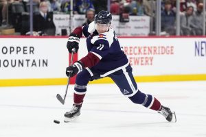 Colorado Avalanche Playe dribbling the puck