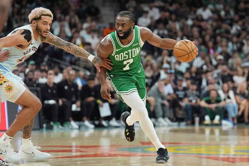 Celtics player dribbling pas another player