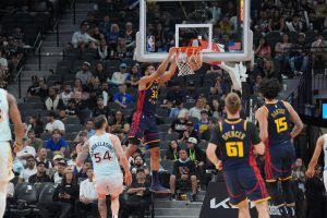 Warriors player making a dunk