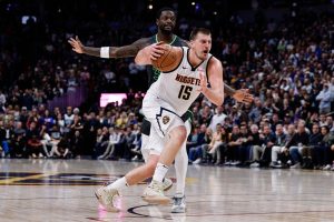 Jokic Being Fouled While dribbling the ball