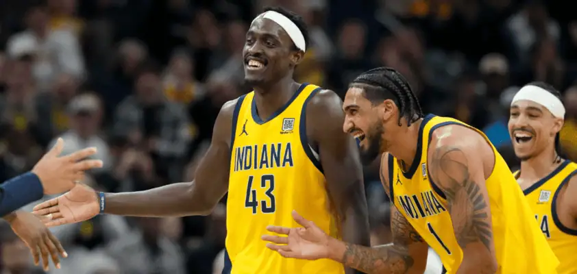 Indiana Pacers vs Orlando Magic Picks and Predictions April 11th 2025 3 Indiana Pacers players in yellow uniforms, including number 43 and number 1, share a lighthearted moment and smiles during an NBA game