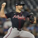 Atlanta Braves pitcher delivers a pitch during game vs Phillies