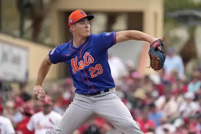 St. Louis Cardinals vs New York Mets Picks and Predictions May 4th 2025 3 A New York Mets pitcher in a blue and orange uniform prepares to throw a pitch