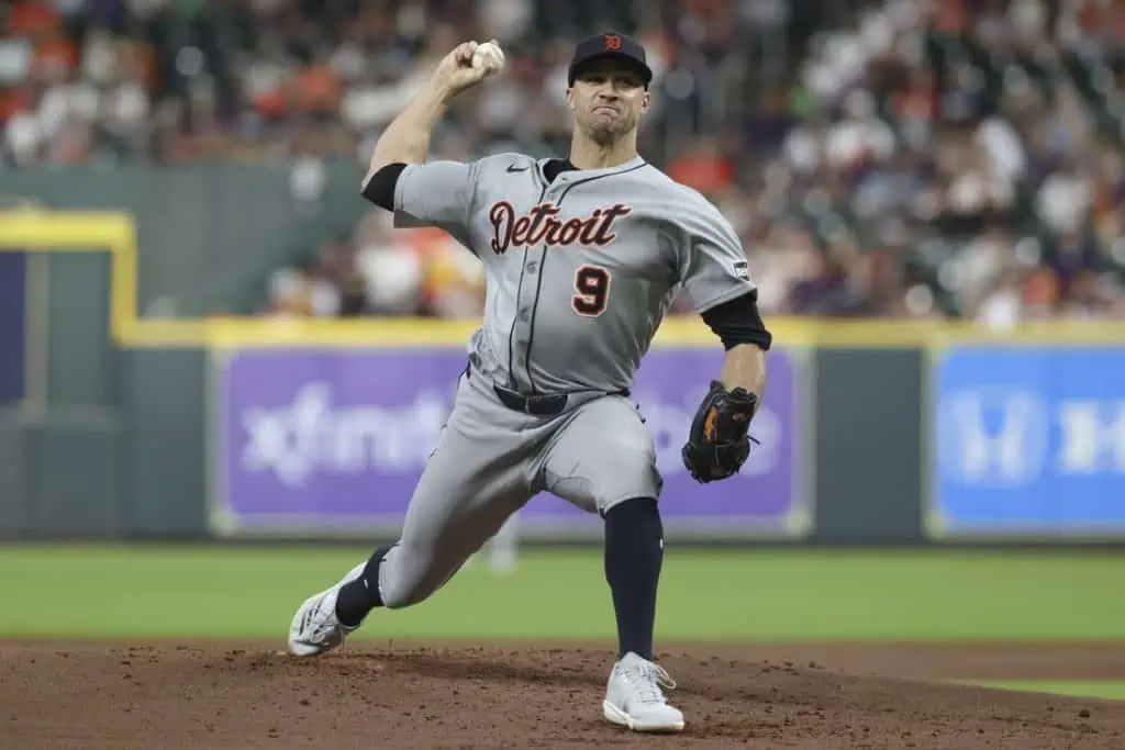 A Detroit Tigers pitcher in gray uniform throws a baseball on the mound during a game