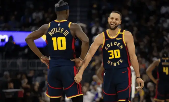 Golden State Warriors vs Minnesota Timberwolves Picks and Predictions May 12th 2025 3 Stephen Curry laughs with teammate during Warriors game