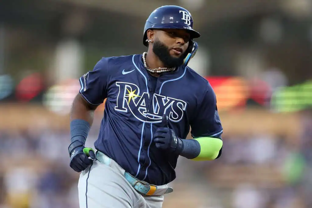 Tampa Bay Rays vs Kansas City Royals Picks and Predictions May 1st 2025 2 A Tampa Bay Rays player runs on the field, wearing a dark blue jersey with the team logo, showcasing athleticism and focus during a game.
