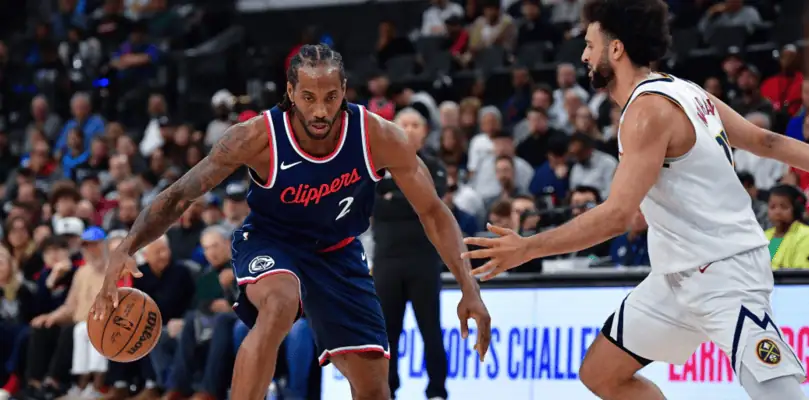 Denver Nuggets vs La Clippers Picks and Predictions May 3rd 2025 2 Kawhi Leonard of the LA Clippers dribbles the ball while being defended by Jamal Murray of the Denver Nuggets during an NBA game with a full crowd watching.