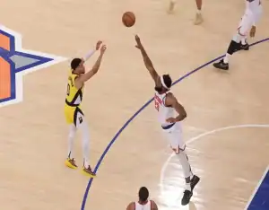 Indiana Pacers player shoots over New York Knicks defender during May 23, 2025 game at Madison Square Garden.