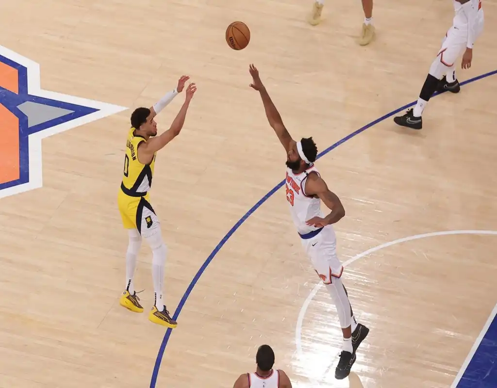 Indiana Pacers player shoots over New York Knicks defender during May 23, 2025 game at Madison Square Garden.