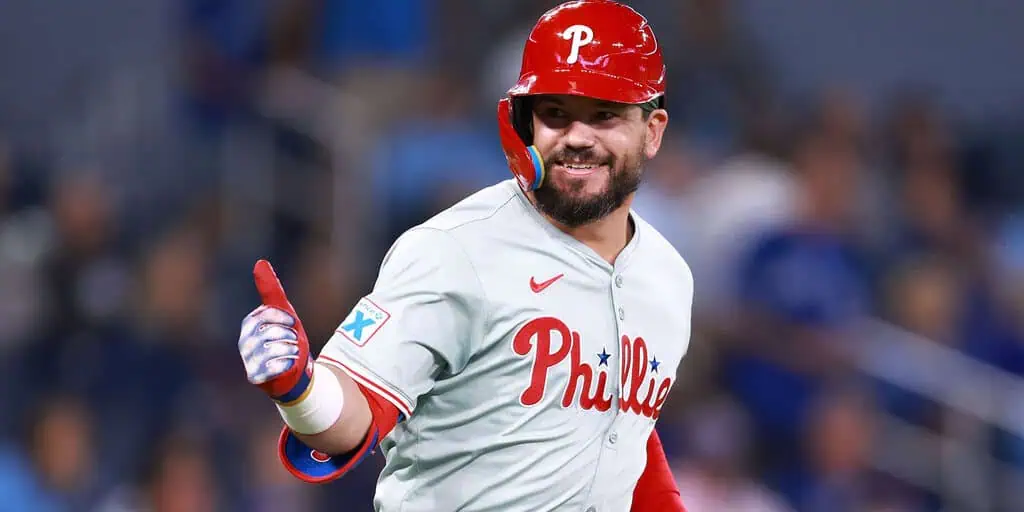 Philadelphia Phillies vs St. Louis Cardinals Picks and Predictions May 12th 2025 2 A Philadelphia Phillies player in a gray uniform and red helmet gestures confidently during a game, celebrating a moment of success.