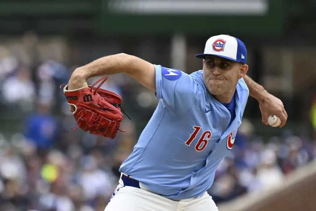New York Mets vs Chicago Cubs Picks and Predictions May 11th 2025 2 A baseball player in a light blue jersey with the number 16 is in mid-pitch, wearing a red glove and holding a baseball.