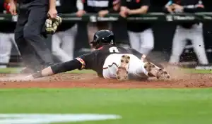 Baltimore Orioles player slides into home plate during matchup with Chicago White Sox on May 31, 2025
