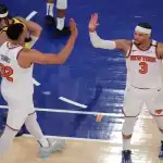 New York Knicks players high-five during game against Indiana Pacers on May 31, 2025