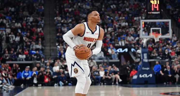 Denver Nuggets vs La Clippers Picks and Predictions May 3rd 2025 3 Russell Westbrook prepares to shoot a basketball while wearing a Denver Nuggets jersey during an NBA game