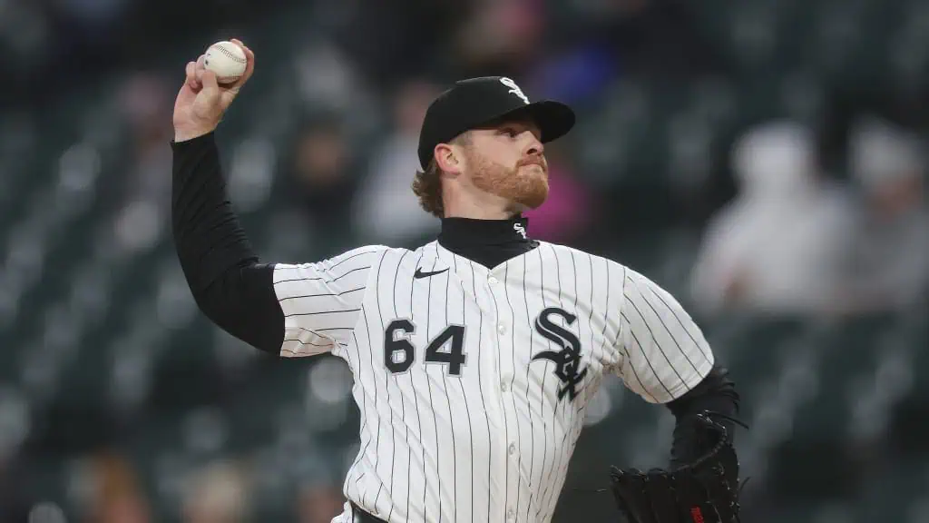 Chicago Cubs vs Chicago White Sox Picks and Predictions May 16th 2025 2 A Chicago White Sox pitcher in a white striped jersey winds up to throw a baseball on a cloudy day at the stadium.