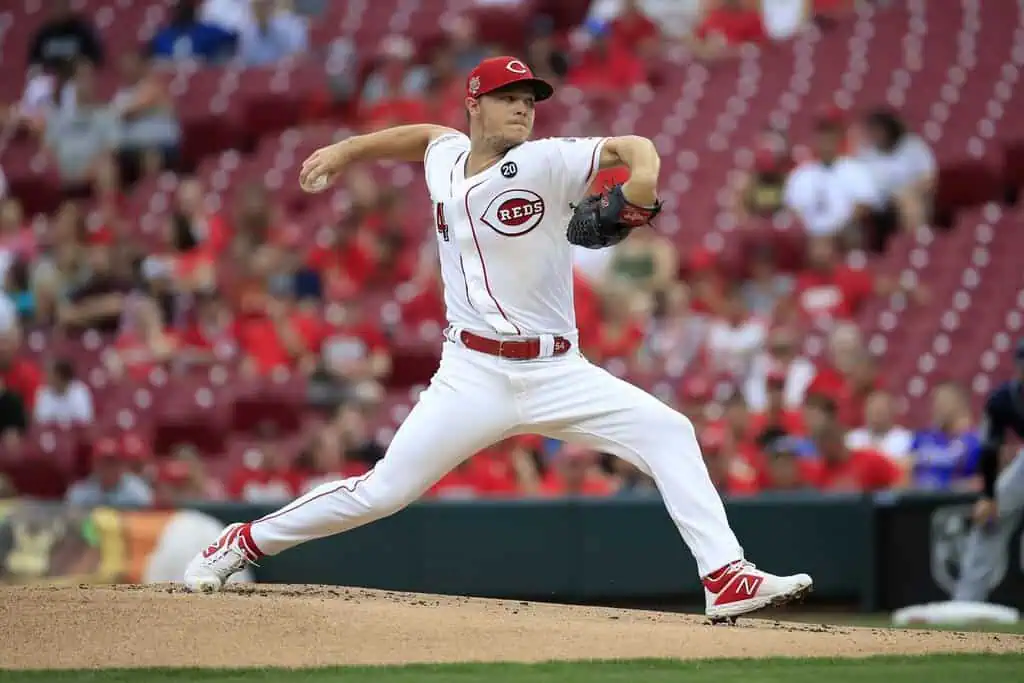St. Louis Cardinals vs New York Mets Picks and Predictions May 2nd 2025 2 A pitcher in a white Cincinnati Reds uniform winds up to throw a baseball