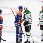 Edmonton Oilers and Dallas Stars players shake hands after their playoff game on May 21, 2025.