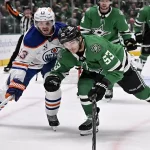 Dallas Stars and Edmonton Oilers players battle for puck during game on May 23, 2025.