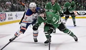 Dallas Stars and Edmonton Oilers players battle for puck during game on May 23, 2025.