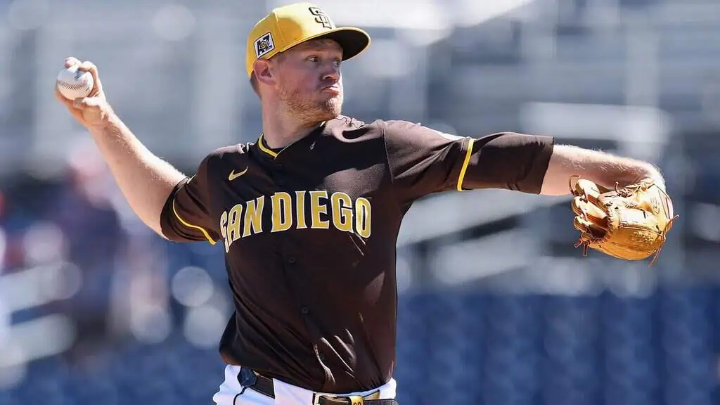 Pittsburgh Pirates vs San Diego Padres Picks and Predictions May 4th 2025 2 A baseball player in a brown and yellow San Diego uniform winds up to pitch, holding a baseball and wearing a glove.