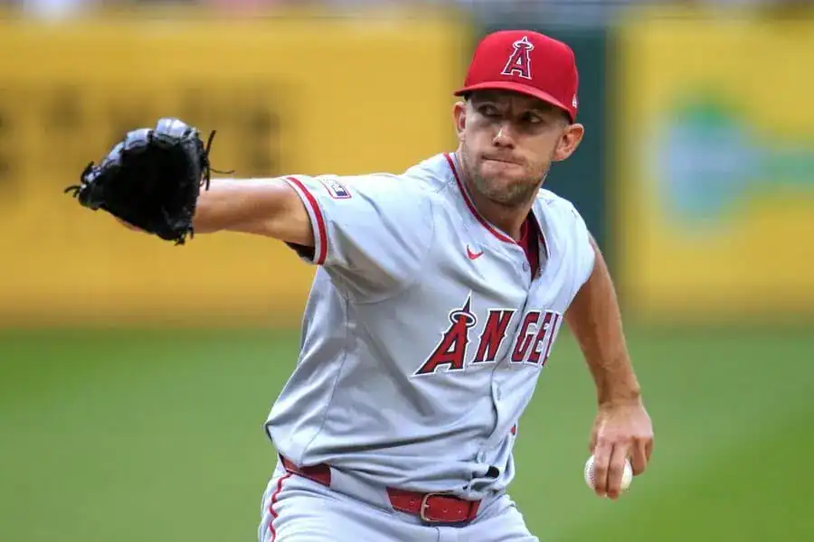 Los Angeles Angels vs Baltimore Orioles Picks and Predictions May 11th 2025 2 A baseball pitcher in an Angels uniform prepares to throw a pitch on the field, showcasing an intense focus and athletic stance.