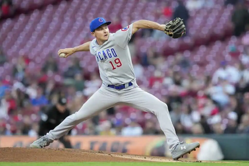 Milwaukee Brewers vs Houston Astros Picks and Predictions May 6th 2025 2 A Chicago Cubs pitcher in a gray uniform winds up to throw a pitch on the baseball mound during a game, with a blurred crowd in the background.
