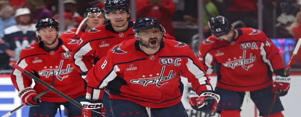 Carolina Hurricanes vs Washington Capitals Picks and Predictions May 12th 2025 2 Washington Capitals players celebrate during an NHL game