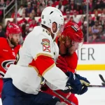 Florida Panthers and Carolina Hurricanes players battle for the puck during their May 20, 2025 game