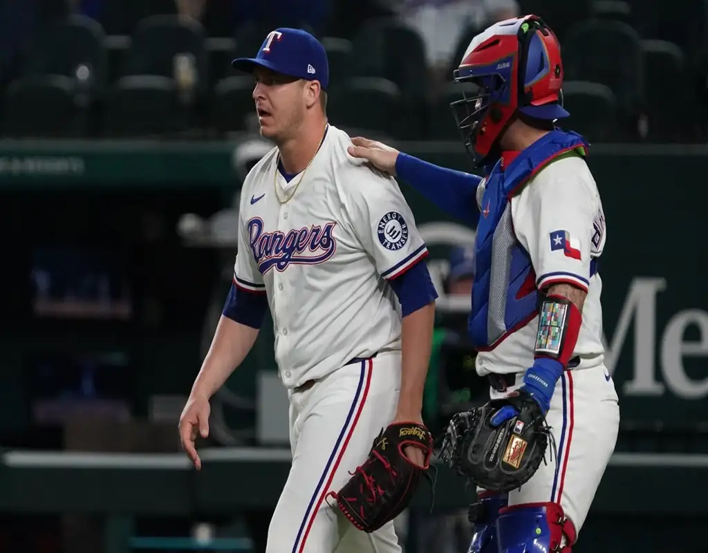 Texas Rangers pitcher and catcher regroup during May 13, 2025 MLB matchup vs Colorado Rockies