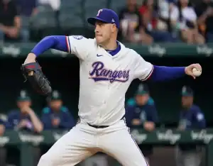 Texas Rangers pitcher delivers a pitch during May 14, 2025 MLB matchup vs Colorado Rockies
