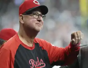 Cincinnati Reds coach watches from dugout during May 13, 2025 MLB matchup against Chicago White Sox