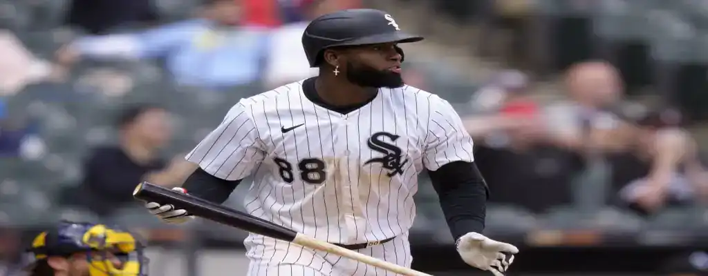 Baltimore Orioles vs Chicago White Sox Picks and Predictions May 31st 2025 2 Chicago White Sox player stands at home plate holding a bat, wearing a white pinstripe uniform during a baseball game.