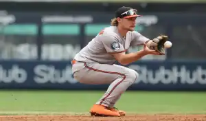Baltimore Orioles infielder fields a ground ball during MLB game against Texas Rangers on June 23rd 2025