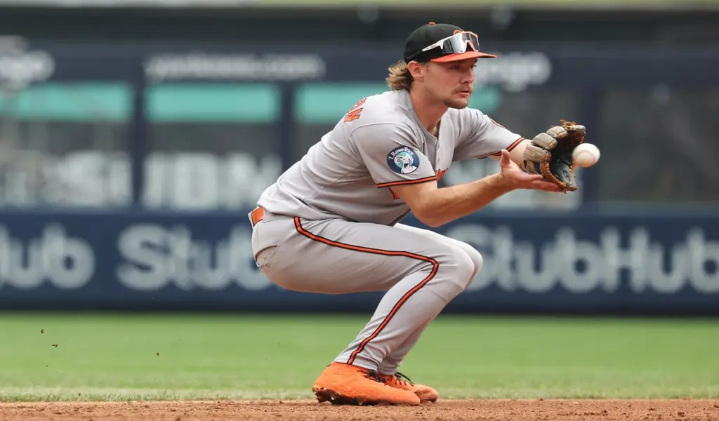 Baltimore Orioles infielder fields a ground ball during MLB game against Texas Rangers on June 23rd 2025