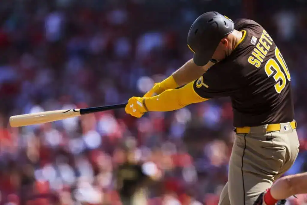 San Diego Padres player Gavin Sheets, number 30, swings a bat during a baseball game.