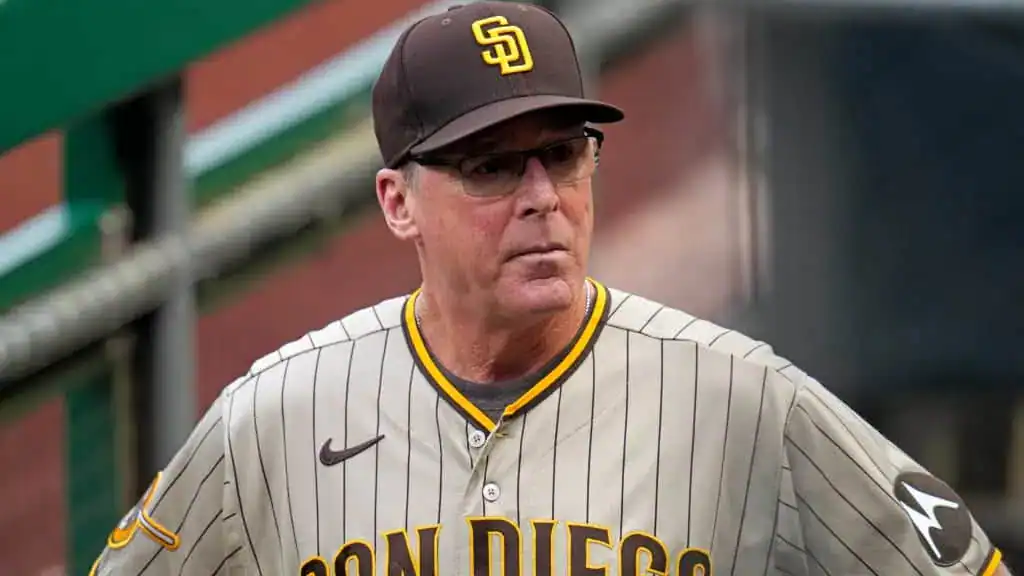 San Francisco Giants vs San Diego Padres Picks and Predictions June 5th 2025 2 A person in a San Diego Padres jersey is standing on the baseball field, wearing a cap and looking towards the game.