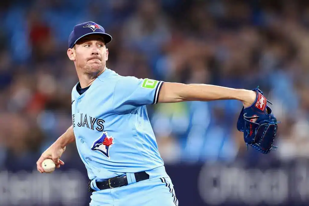 Boston Red Sox vs Toronto Blue Jays Picks and Predictions June 29th 2025 2 A pitcher in a light blue jersey and cap is in mid-throw on the baseball mound, gripping a ball.
