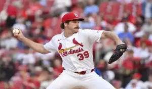 St. Louis Cardinals pitcher winds up during MLB matchup vs Cleveland Guardians on June 28th 2025