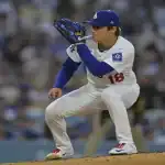 Los Angeles Dodgers pitcher prepares to pitch during MLB game against Colorado Rockies on June 25th 2025