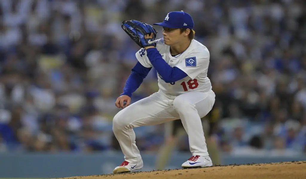 Los Angeles Dodgers pitcher prepares to pitch during MLB game against Colorado Rockies on June 25th 2025