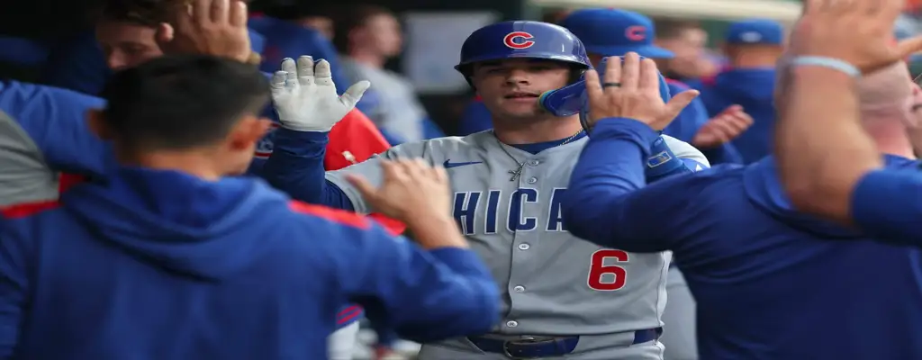 Houston Astros vs Chicago Cubs Picks and Predictions June 28th 2025 2 Chicago Cubs player gets high fives in the dugout after scoring during a road game