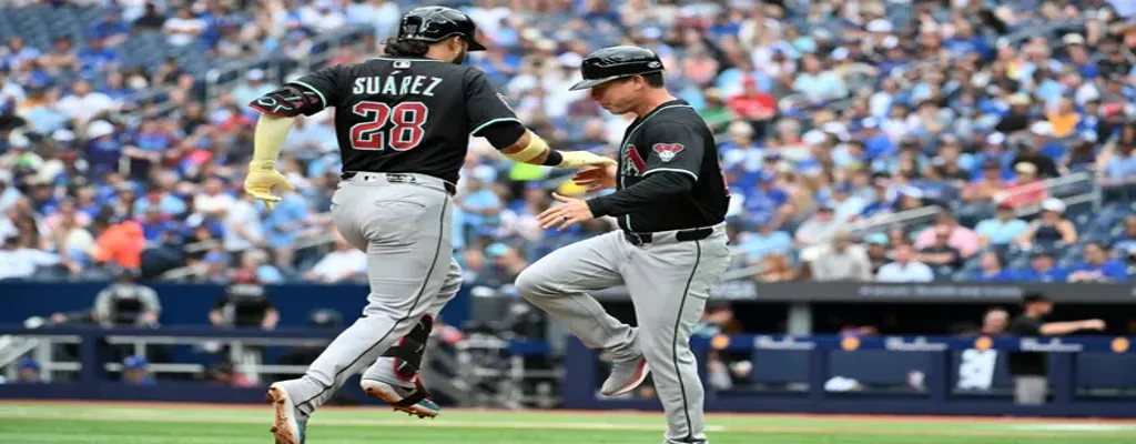 Arizona Diamondbacks vs Miami Marlins Picks and Predictions June 27th 2025 3 Arizona Diamondbacks player Suárez celebrates a home run with a coach at third base