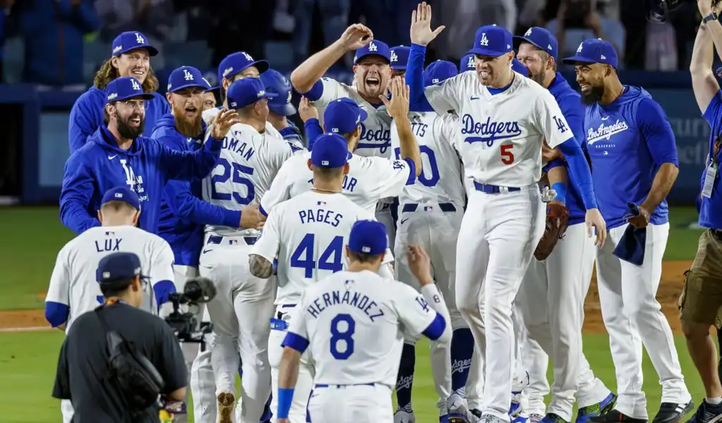 Kansas City Royals vs Los Angeles Dodgers Picks and Predictions June 27th 2025 2 Los Angeles Dodgers players celebrate on the field after a big win