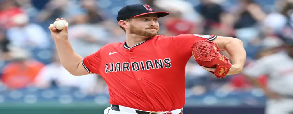 Cleveland Guardians vs St. Louis Cardinals Picks and Predictions June 28th 2025 3 Cleveland Guardians pitcher in red jersey winds up to throw during a game