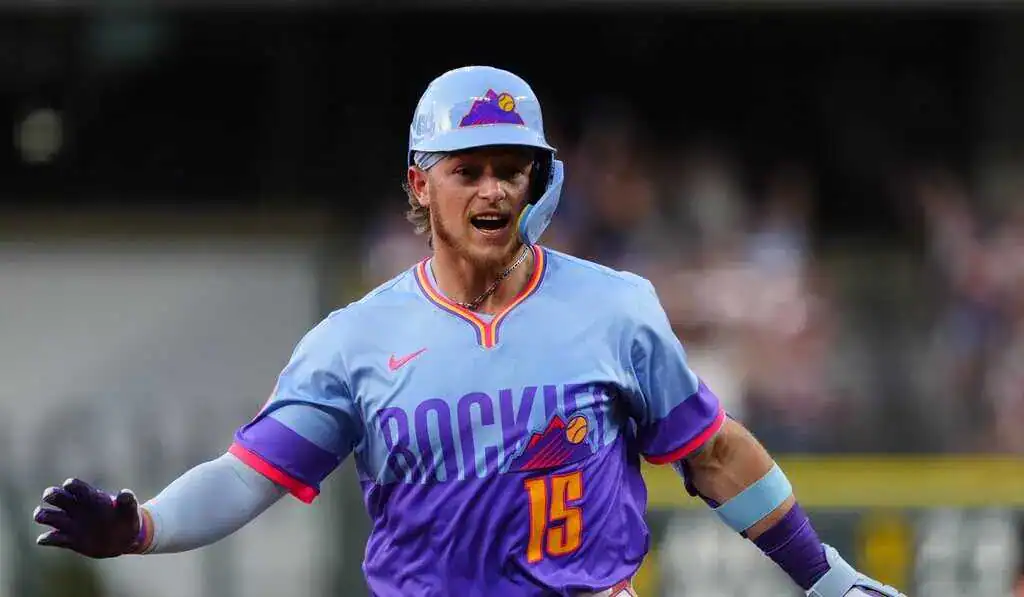 Milwaukee Brewers vs Colorado Rockies Picks and Predictions June 29th 2025 2 A player in a vibrant blue and purple baseball uniform runs passionately on the field, showcasing team spirit and athleticism.