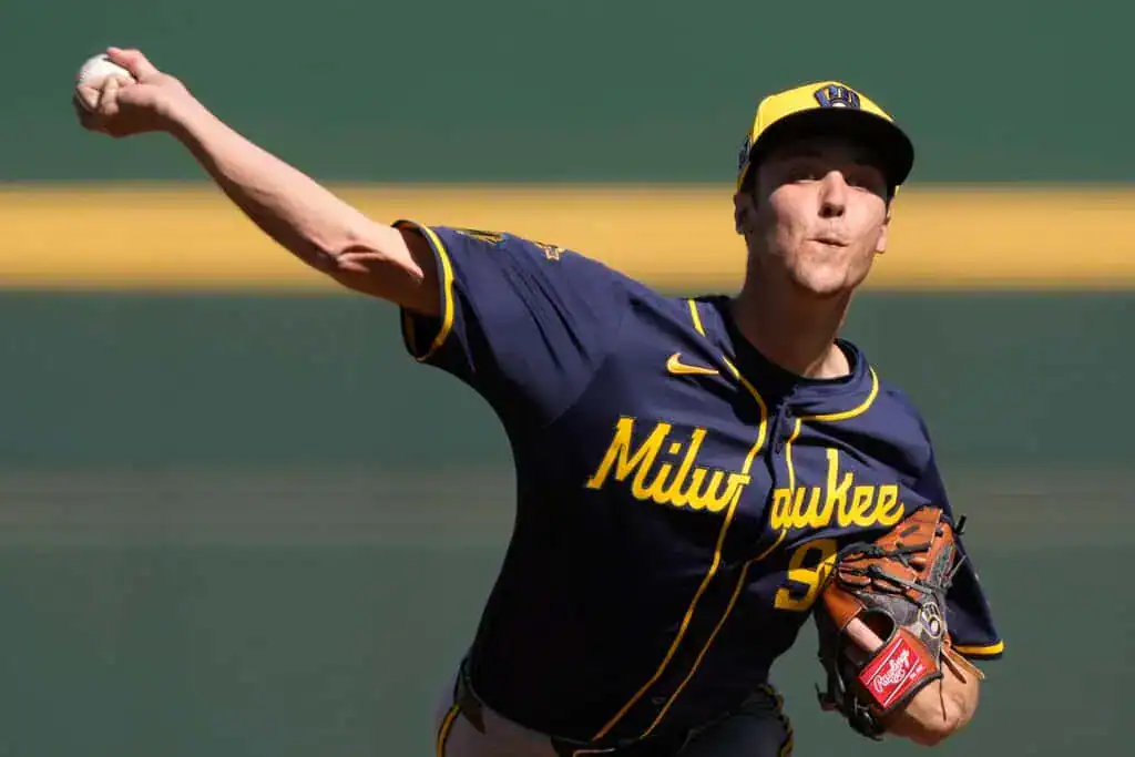 Milwaukee Brewers vs St. Louis Cardinals Picks and Predictions June 13th 2025 2 A baseball pitcher in a Milwaukee Brewers jersey winds up to throw a pitch, showcasing focused athleticism on the field.