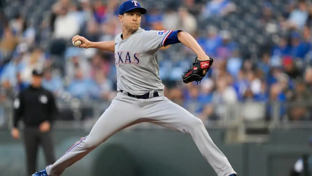 Baltimore Orioles vs Texas Rangers Picks and Predictions June 25th 2025 2 A Texas Rangers pitcher in action, wearing a gray uniform, winds up to throw a baseball on a sunny day at the stadium.