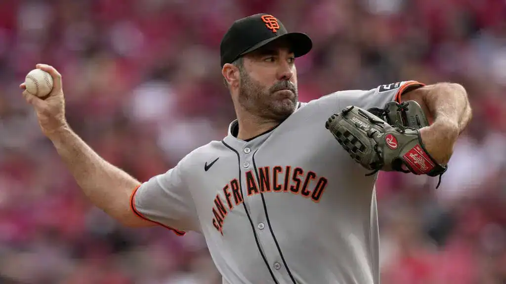 Colorado Rockies vs San Francisco Giants Picks and Predictions June 10th 2025 2 A pitcher in a gray San Francisco Giants uniform throws a baseball, showcasing concentration on the mound amidst a blurred crowd.
