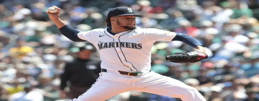Texas Rangers vs Seattle Mariners Picks and Predictions June 27th 2025 2 Seattle Mariners pitcher in full windup mid-pitch during a sunny home game